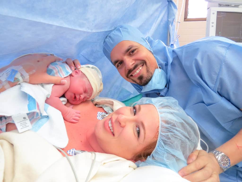 Our first photo as a family of 3 with our baby girl in the OR after my c-section surgery