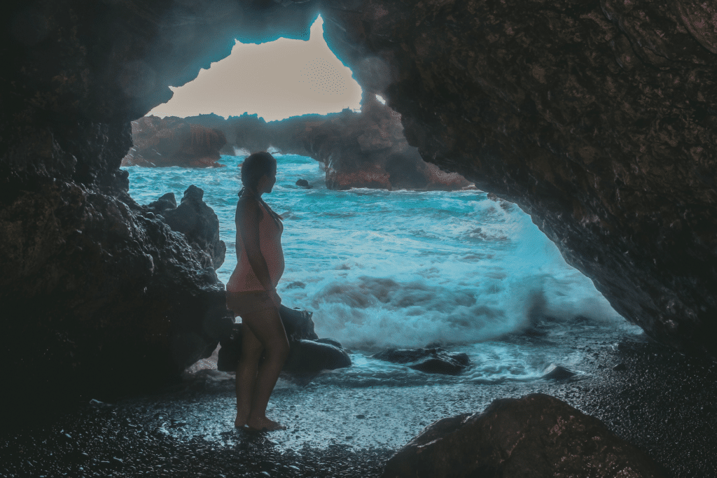 Road to Hana cave on black sand beach