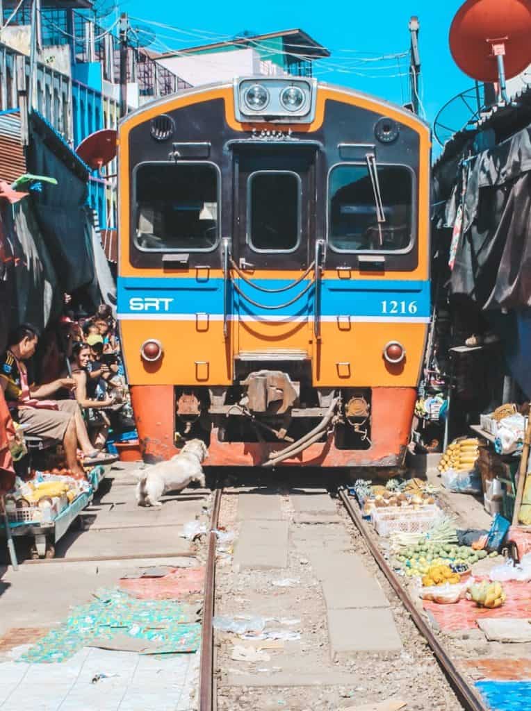 The railway market in Thailand... the train goes right past all the vendors. When the train is coming they pull back their canopies to make space for the train. Tour of the Railway Market and Floating Market from Bangkok, Thailand. #bangkok #thailand #railwaymarket #floatingmarket
