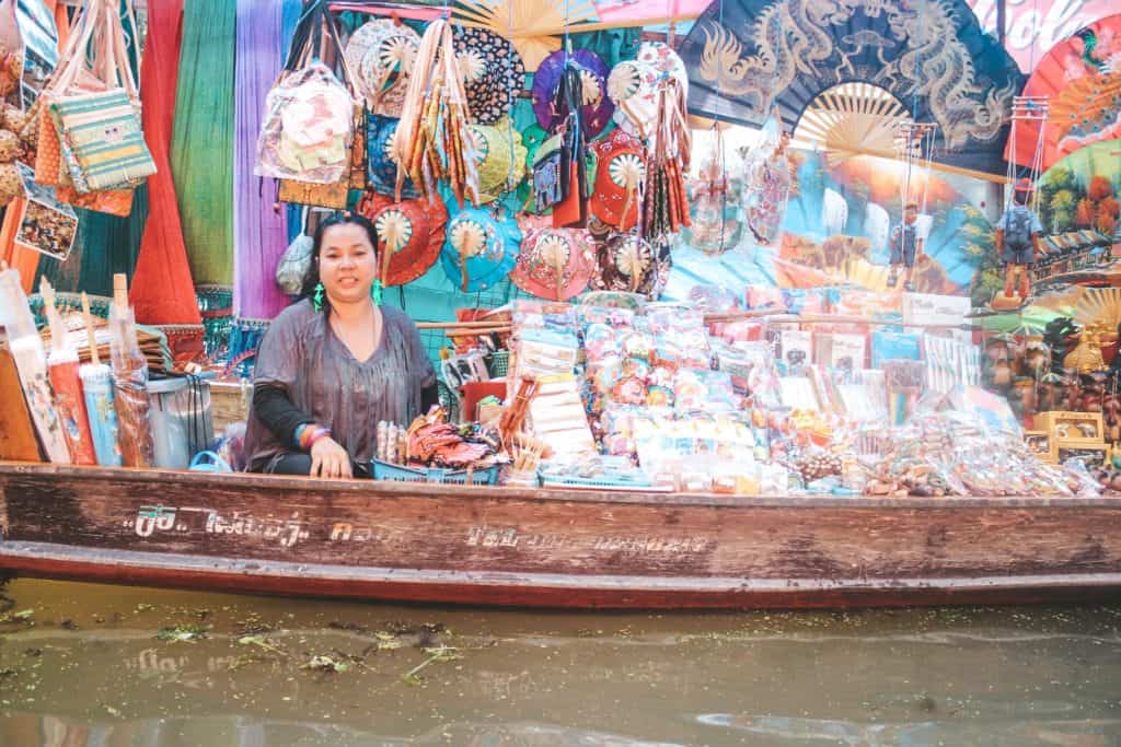 One of the vendors at the floating market in Thailand... an entire market on the waterway and the vendors are each on their little boats. Tour of the Railway Market and Floating Market from Bangkok, Thailand. #bangkok #thailand #railwaymarket #floatingmarket