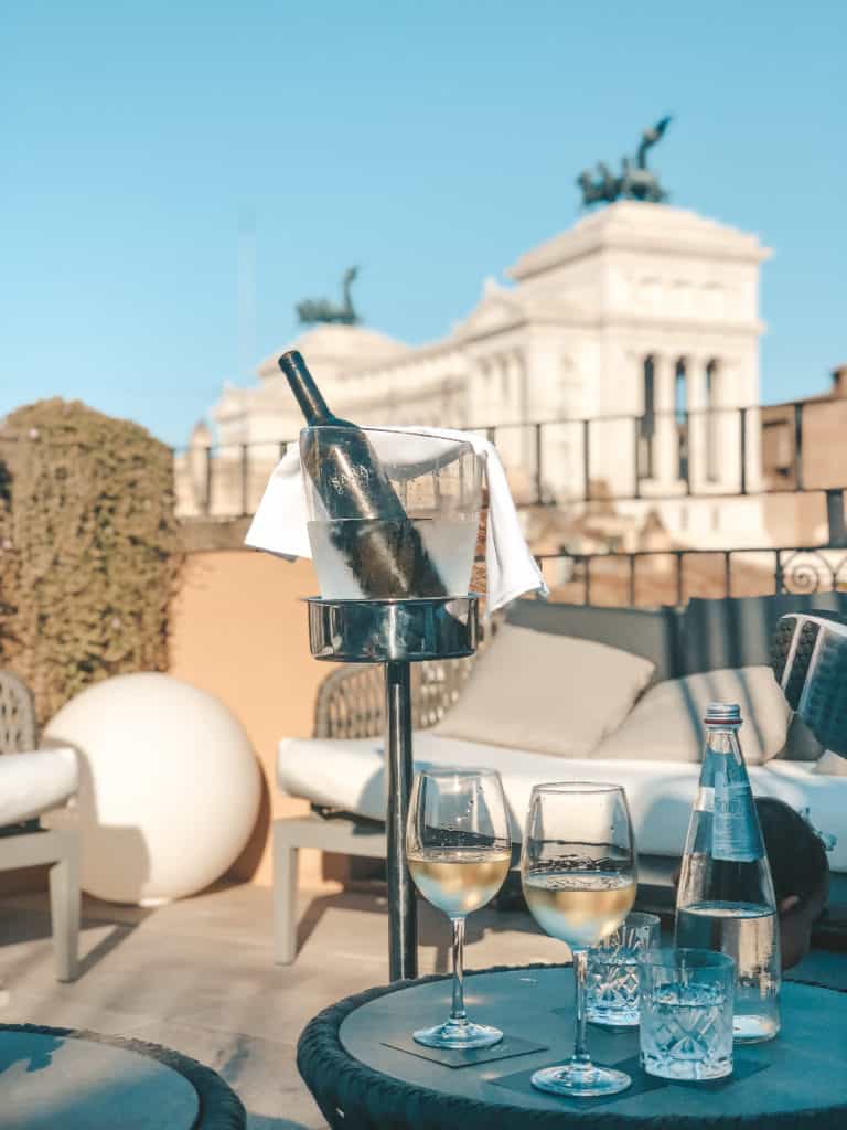 The rooftop bar at the Otivm Hotel in the city center of Rome, walking distance from most of the main sites. It's a budget friendly boutique hotel with great service and super spacious rooms - ours even had a king size bed. Rome | Italy | budget friendly boutique hotel | great service | spacious rooms | king size bed | rooftop bar overlooking the city | best hotel #rome #italy #italia #otivmhotel #besthotel #rooftopbar
