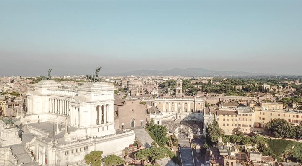 The view from the rooftop bar at the Otivm Hotel in the city center of Rome, walking distance from most of the main sites. It's a budget friendly boutique hotel with great service and super spacious rooms - ours even had a king size bed. Rome | Italy | budget friendly boutique hotel | great service | spacious rooms | king size bed | rooftop bar overlooking the city | best hotel #rome #italy #italia #otivmhotel #besthotel #rooftopbar