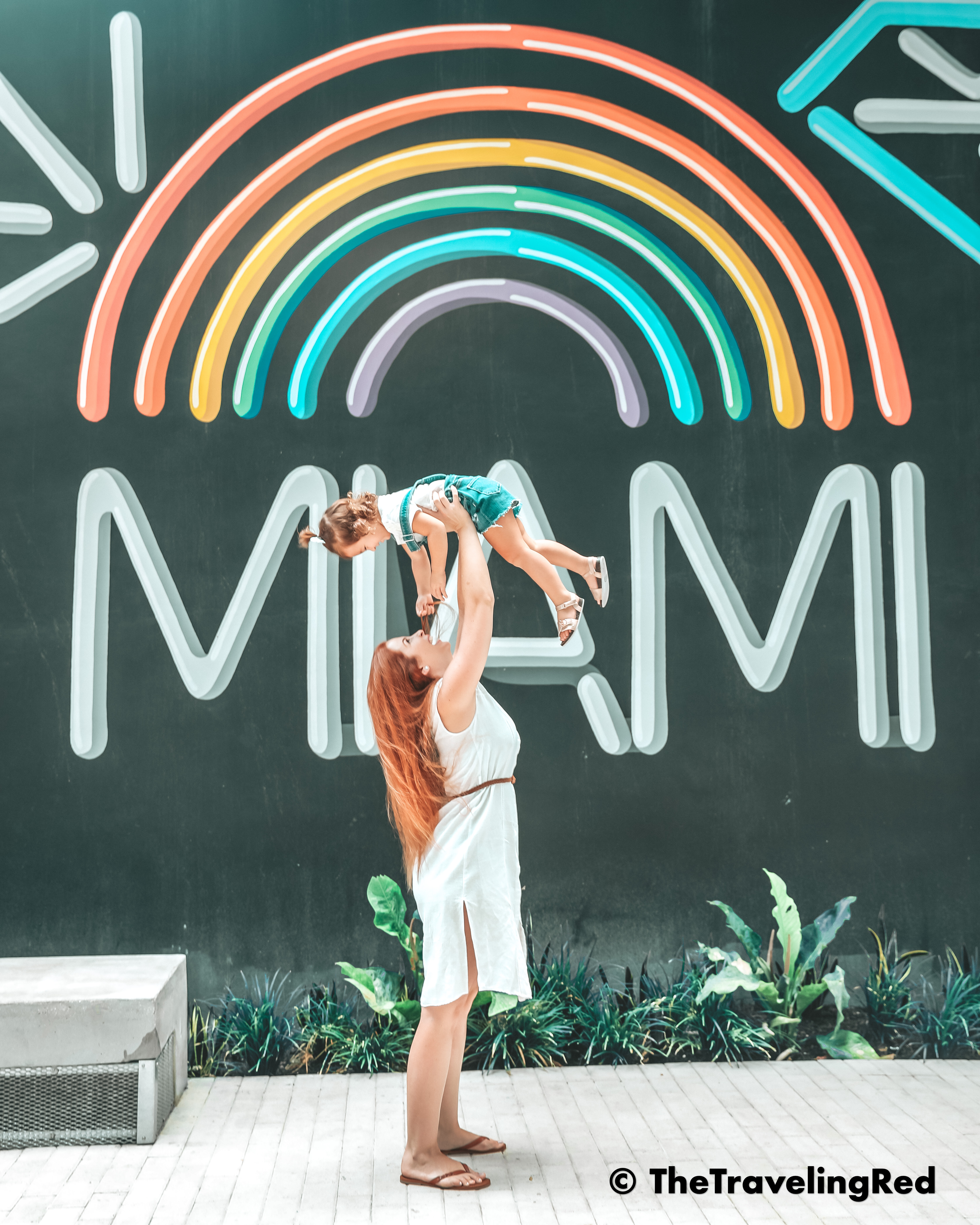 Surprise a kid that doesn't want to take pictures. Use these mom photography hacks like lifting them up over your head to get a big smile from an uncooperative toddler that doesn't want to smile for pictures. #MomHacks #KidPhotography #MomTips #Toddlers #PhotographyTips