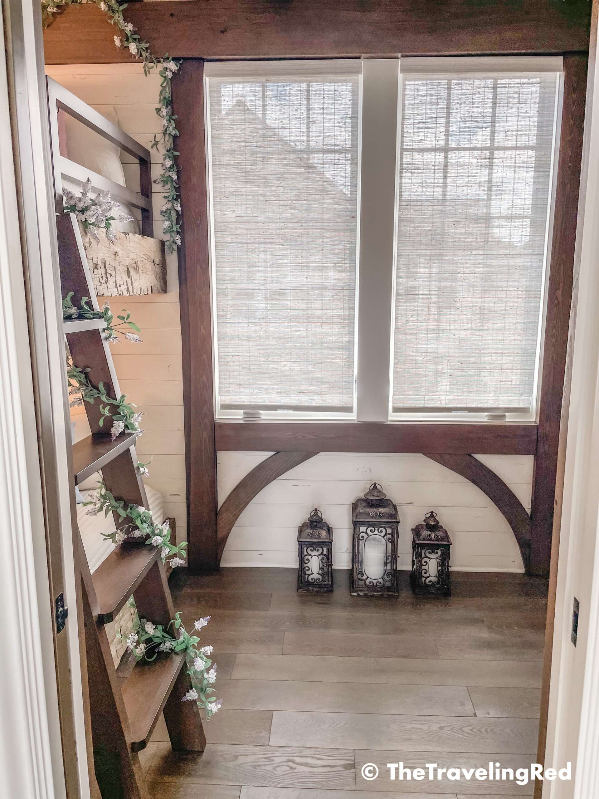 Bambi bunk bed room inside our Disney Golden Oak home. Inspiration for a tiny kids bedroom full of rustic charm and character. Reclaimed wood beams, shiplap, flowers and lanterns fill the room, along with Bambi details.