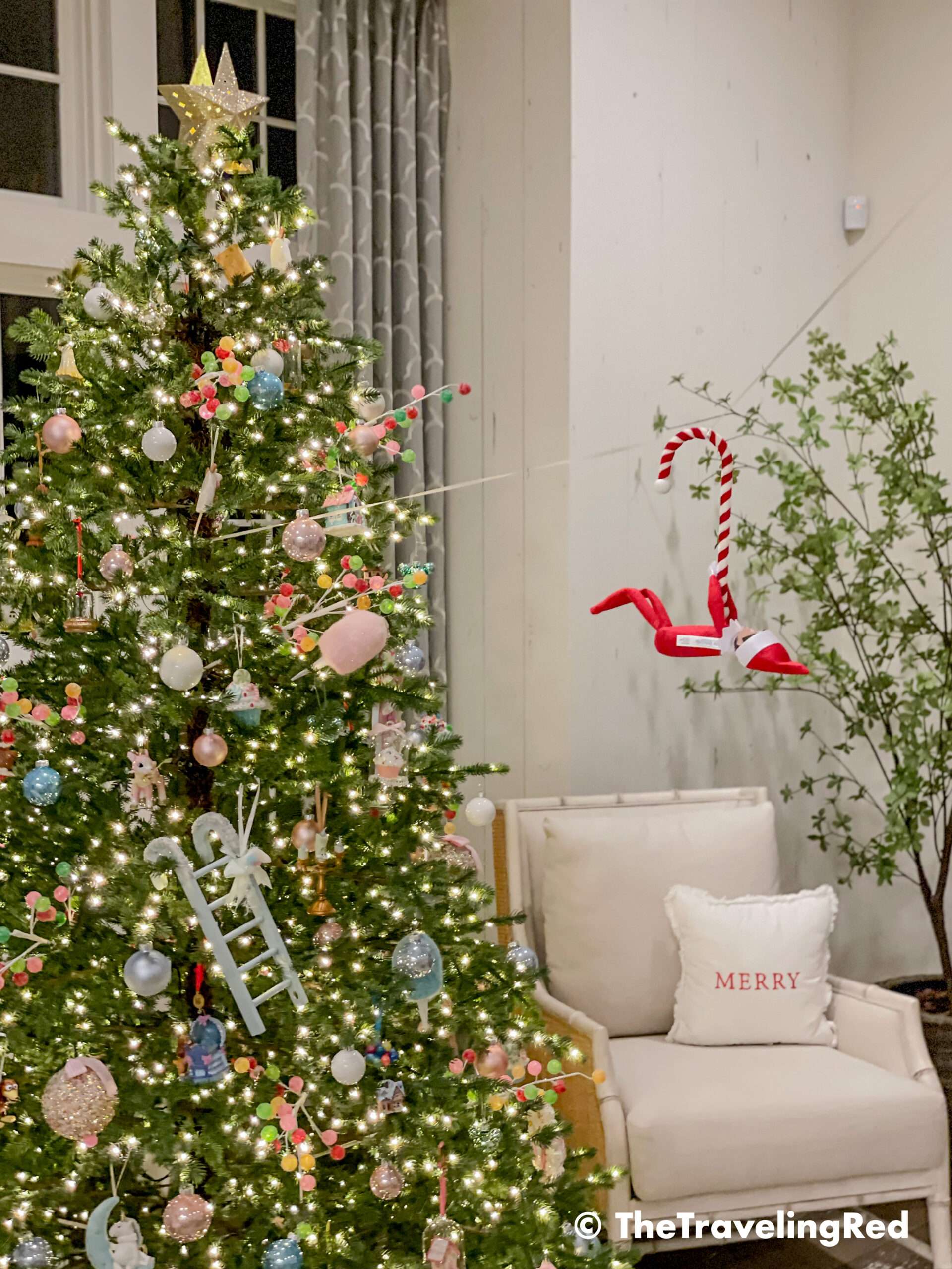 Naughty Elf on the shelf made a zipline from our chandelier to our christmas tree and rode on it using a candy cane. Fun and easy elf on the shelf ideas for a naughty elf that are quick and easy using things you have at home.