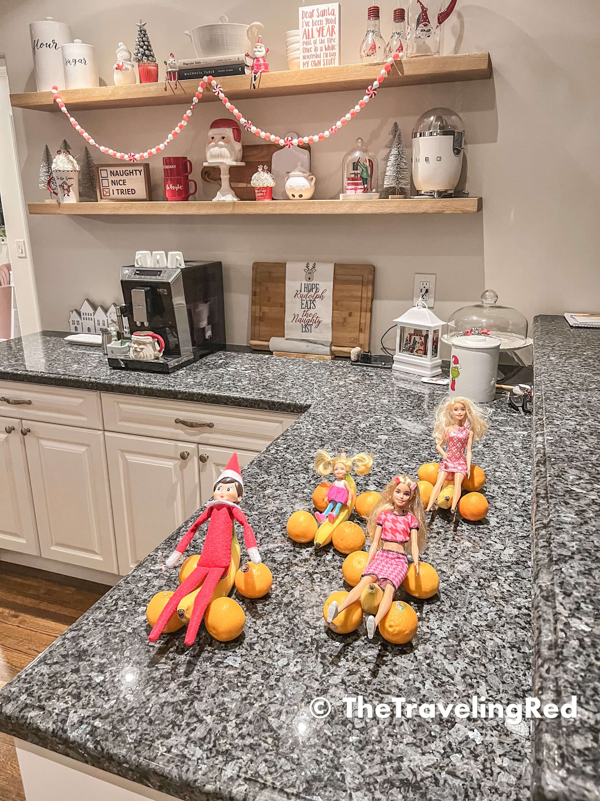 Naughty Elf on the shelf turned bananas and oranges into cars so she could have a race with her Barbie friends. Fun and easy elf on the shelf ideas for a naughty elf that are quick and easy using things you have at home.