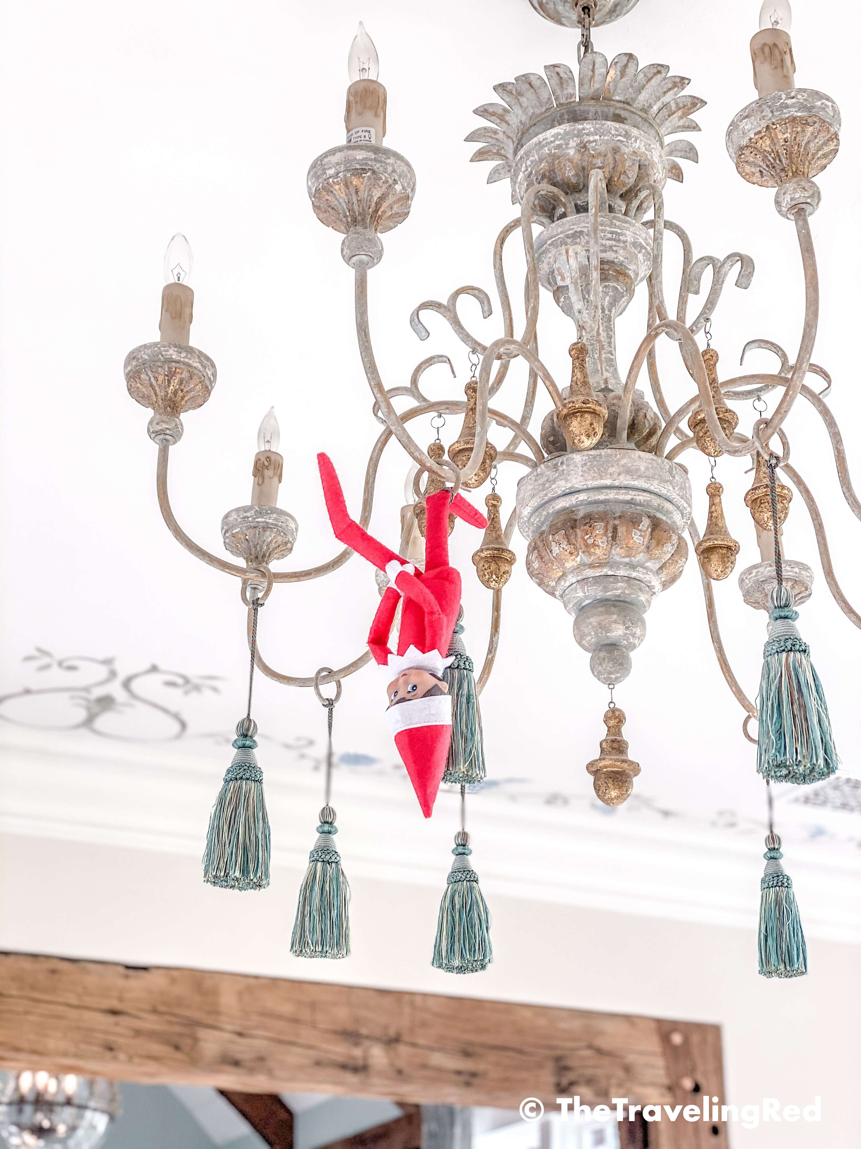 Naughty Elf on the shelf put tiny bottle bruch Christmas trees on all of the toy cars. Fun and easy elf on the shelf ideas for a naughty elf that are quick and easy using things you have at home.