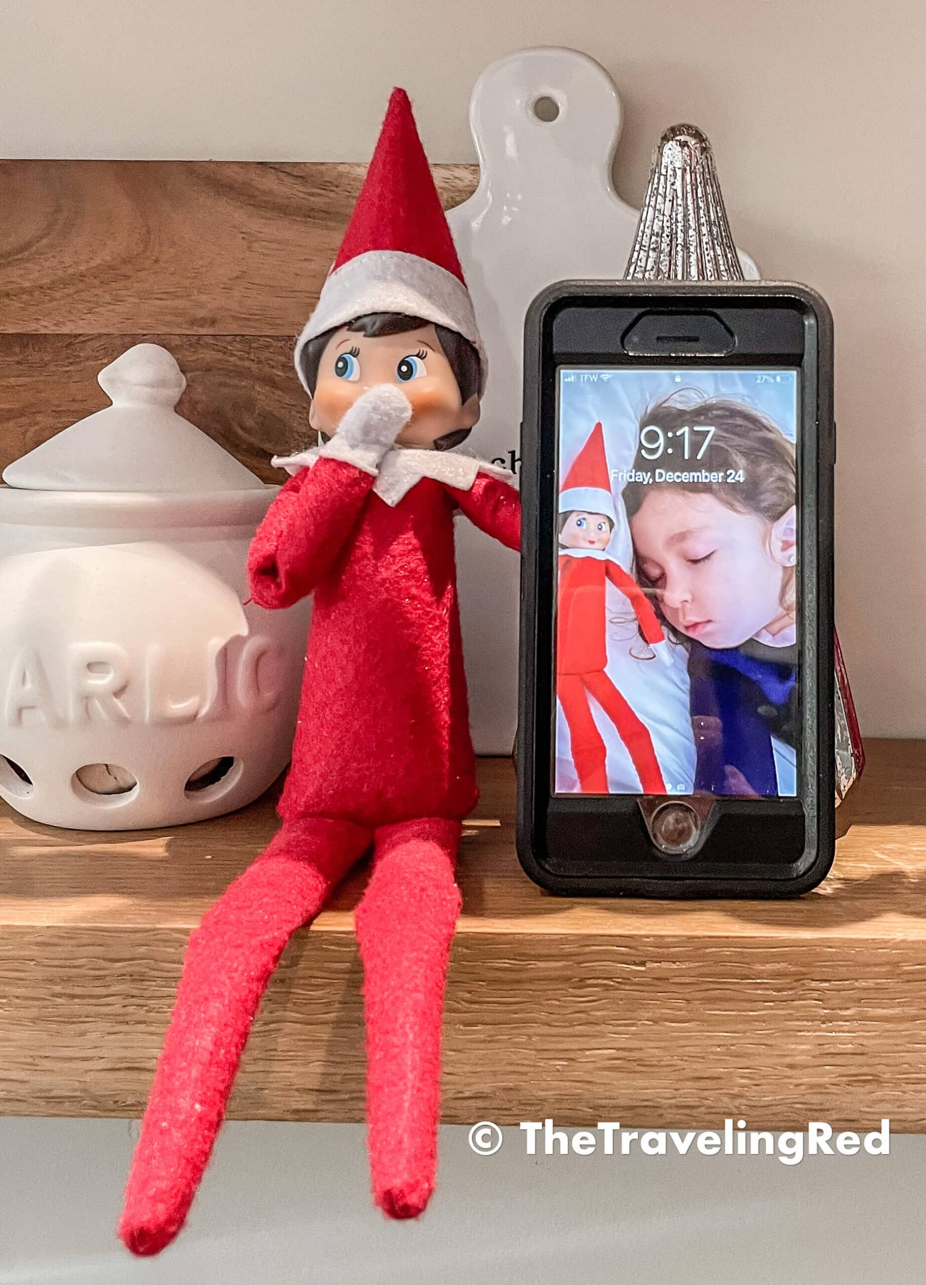 Naughty Elf on the shelf took elfies ( the elf version of selfies) with my daughter while she was sleeping then used the photos as a background on the iPhone. Fun and easy elf on the shelf ideas for a naughty elf that are quick and easy using things you have at home.
