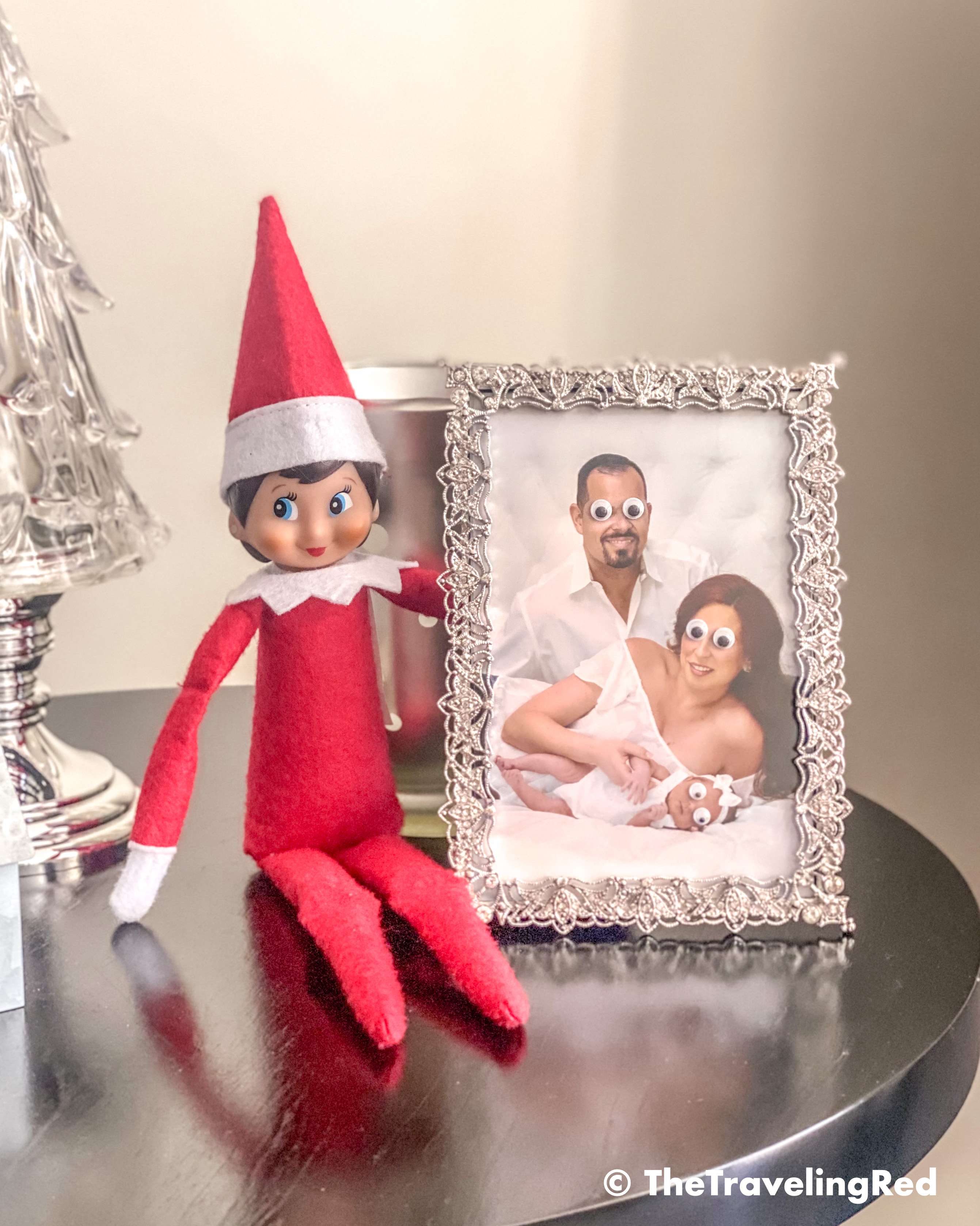 Naughty Elf on the shelf put googly eyes on our family photo. Fun and easy elf on the shelf ideas for a naughty elf that are quick and easy using things you have at home.