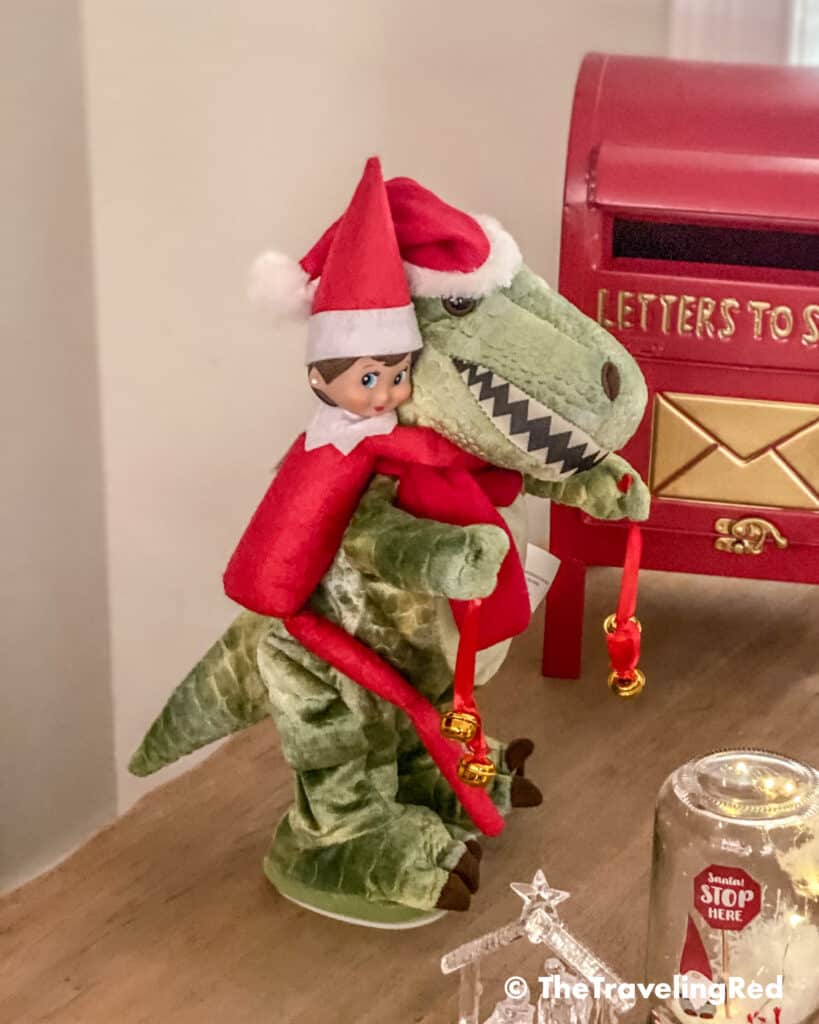 Naughty Elf on the shelf went for a ride on our dinosaur toy. Fun and easy elf on the shelf ideas for a naughty elf that are quick and easy using things you have at home.