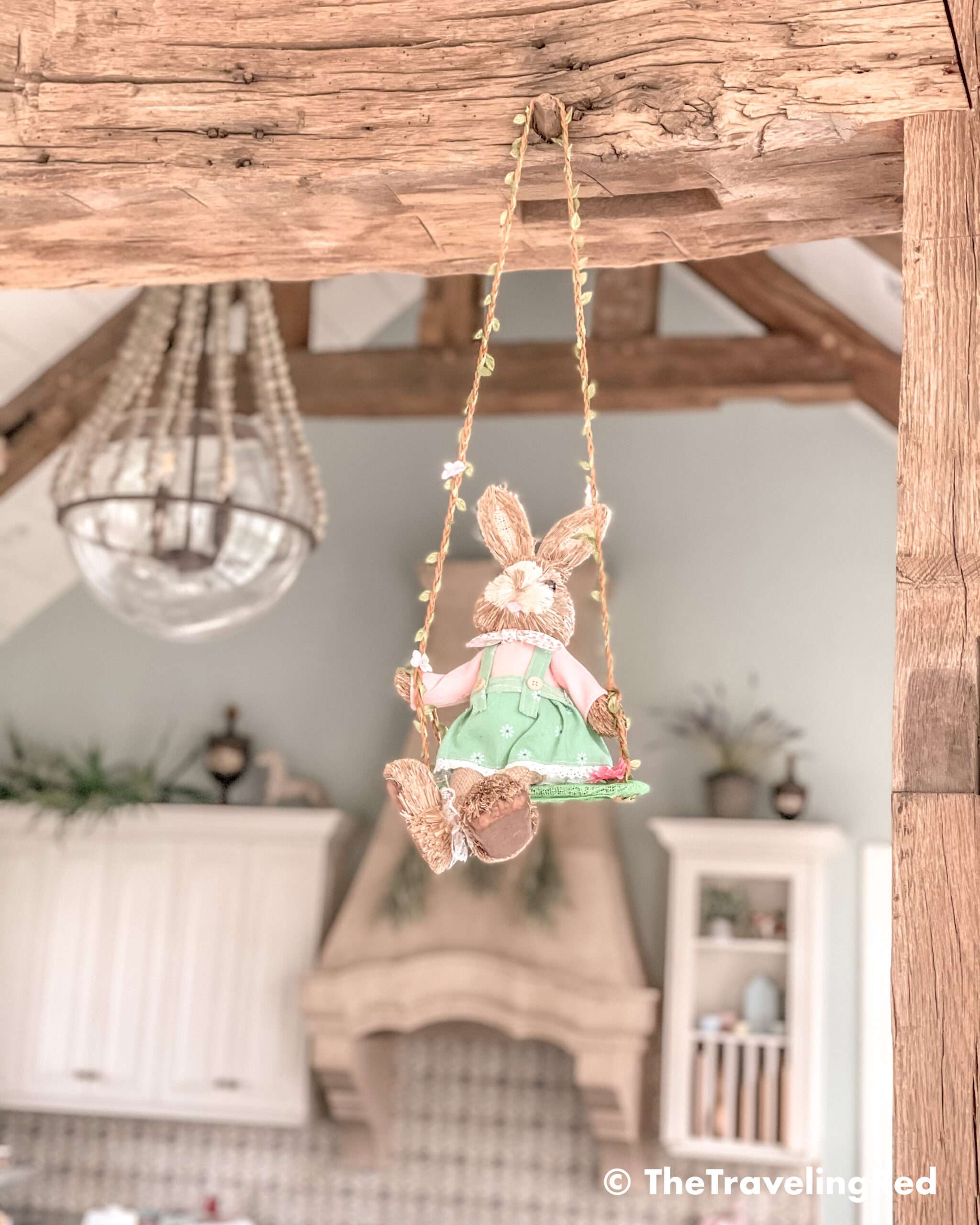 Easter bunny hanging from a swing in the living room. My favorite spring and easter touch as decoration.