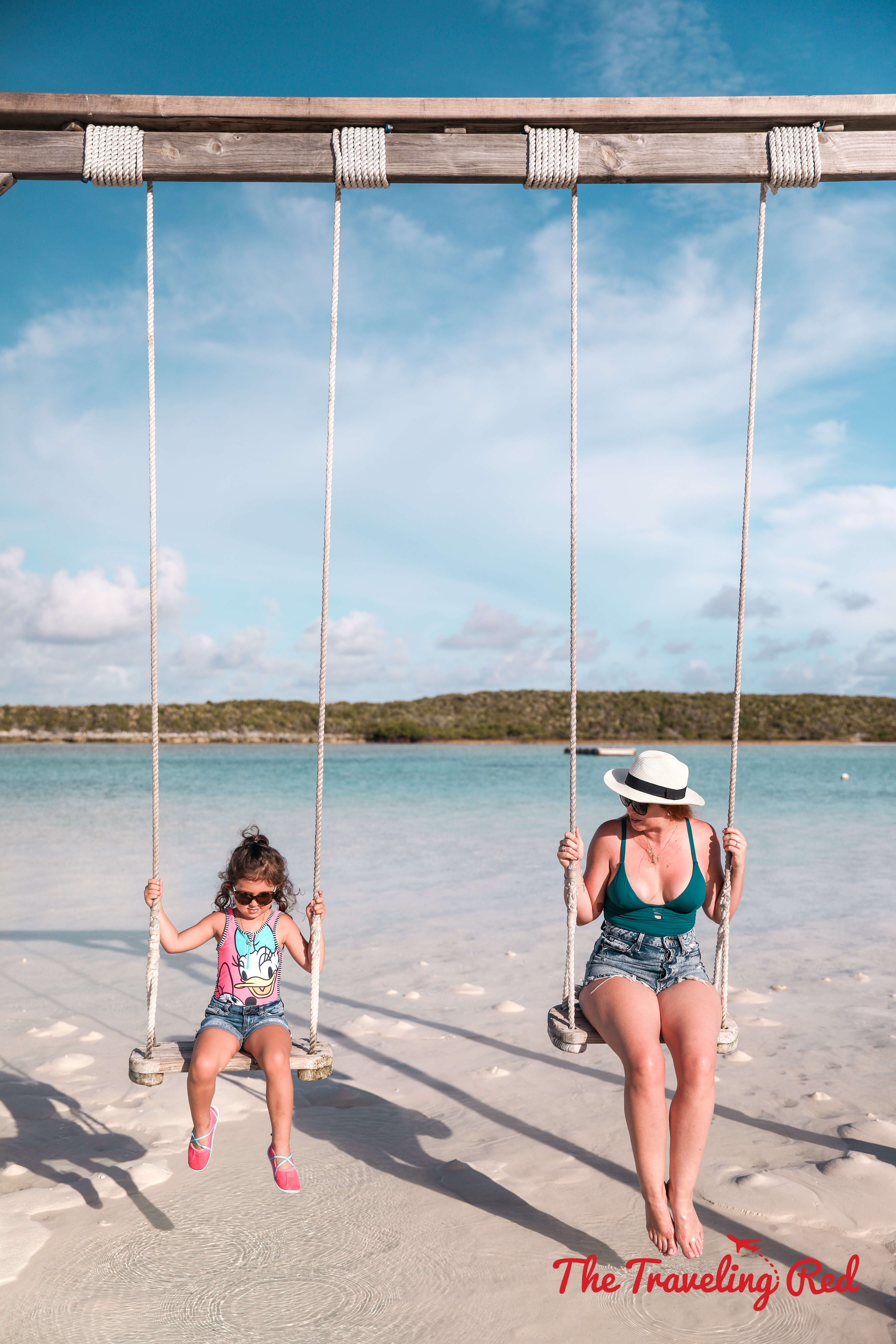 Swing in the ocean in Highborne Cay, one of the islands thats part of Exuma in the Bahamas. This tiny island has a swing at the beach by the marina.