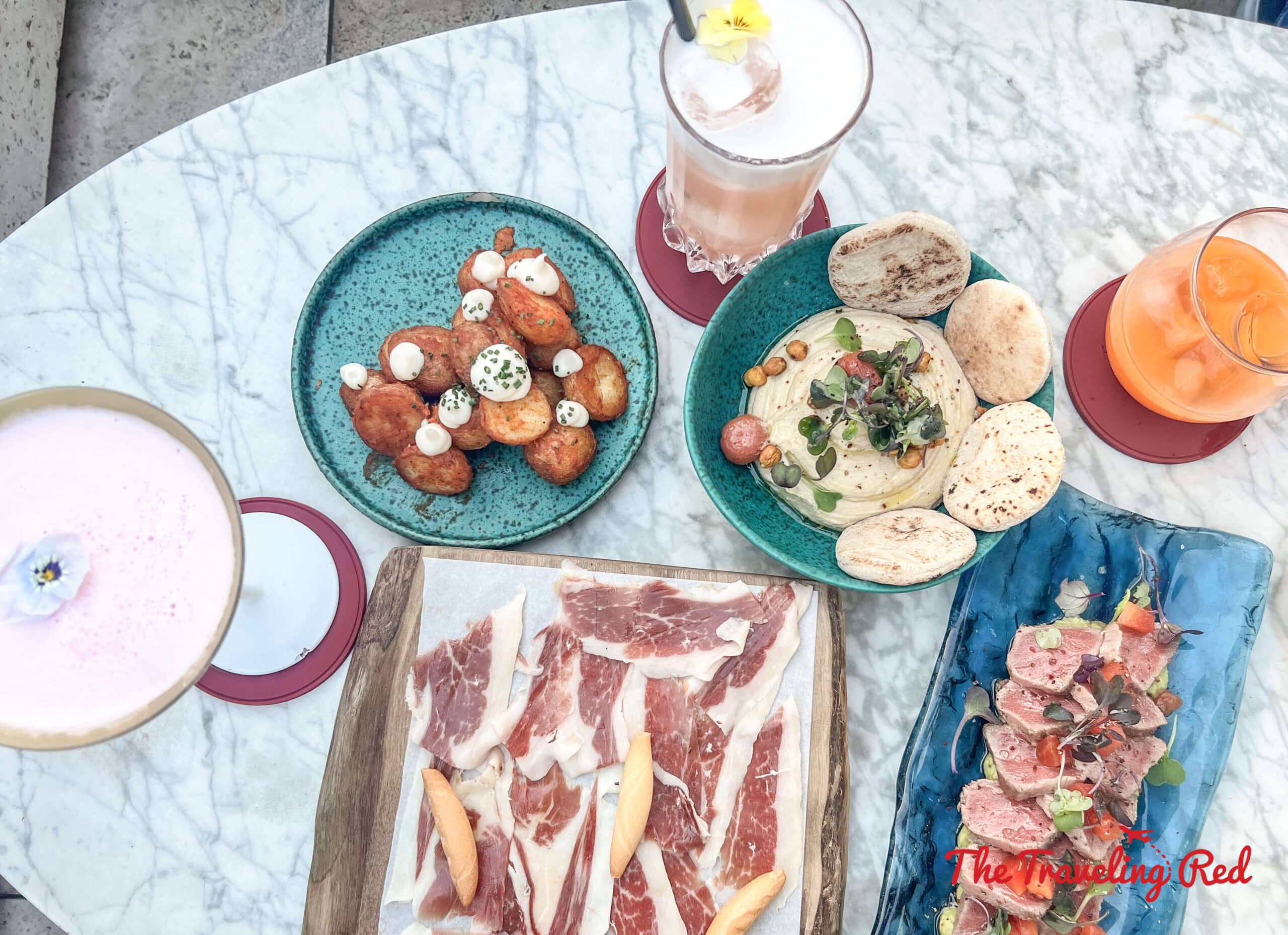 Tapas and cocktails at the Azimuth rooftop bar at the Almanac Barcelona hotel. Kid friendly and beautiful views over the city. Here's our full 7 day barcelona itinerary. Everything you need to know for one week in Barcelona, Spain. By The Traveling Red