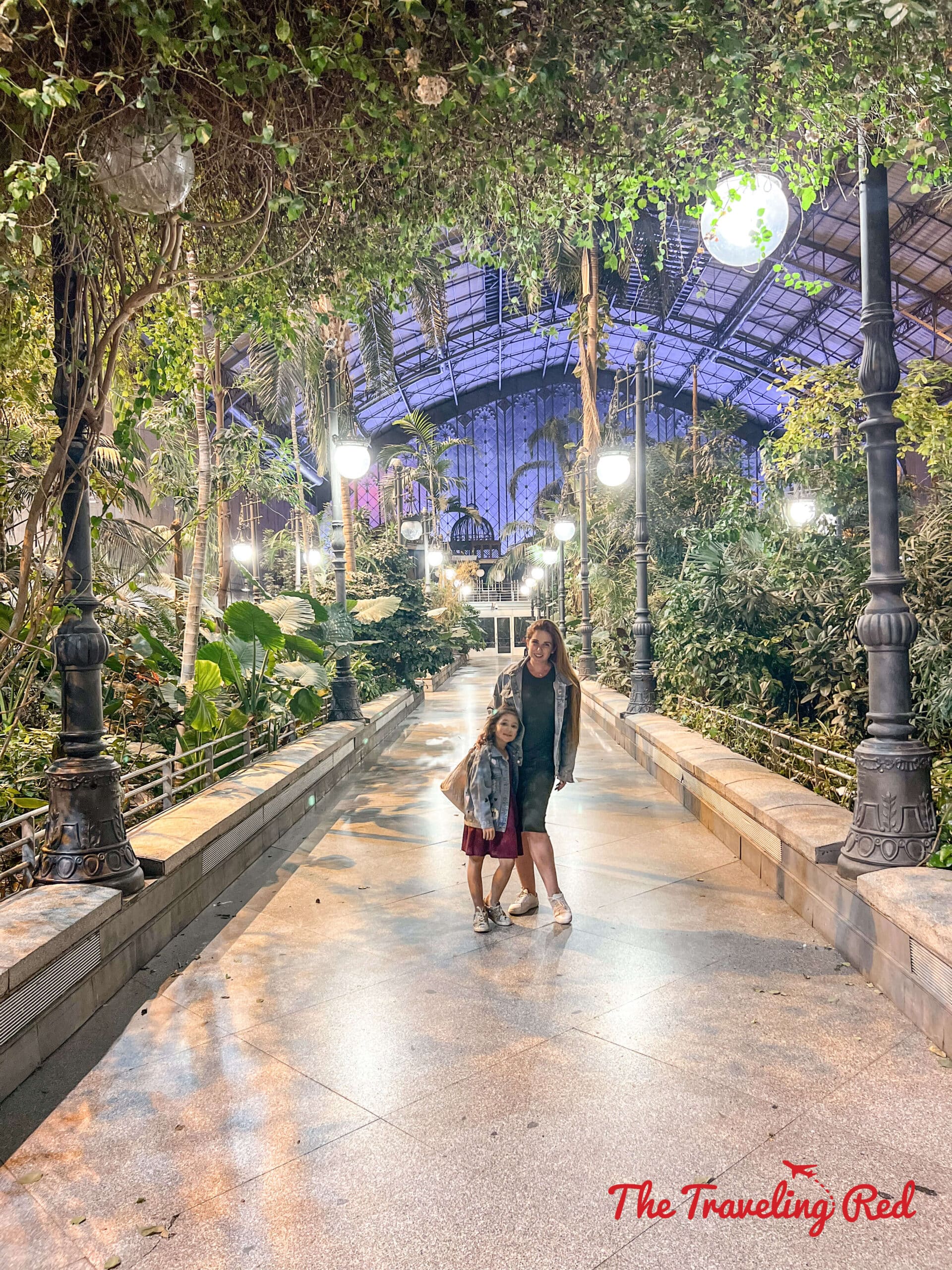 The jungle inside the train station in Madrid Spain. Waiting for our fast train back to Barcelona. Here's our full 7 day barcelona itinerary. Everything you need to know for one week in Barcelona, Spain. By The Traveling Red