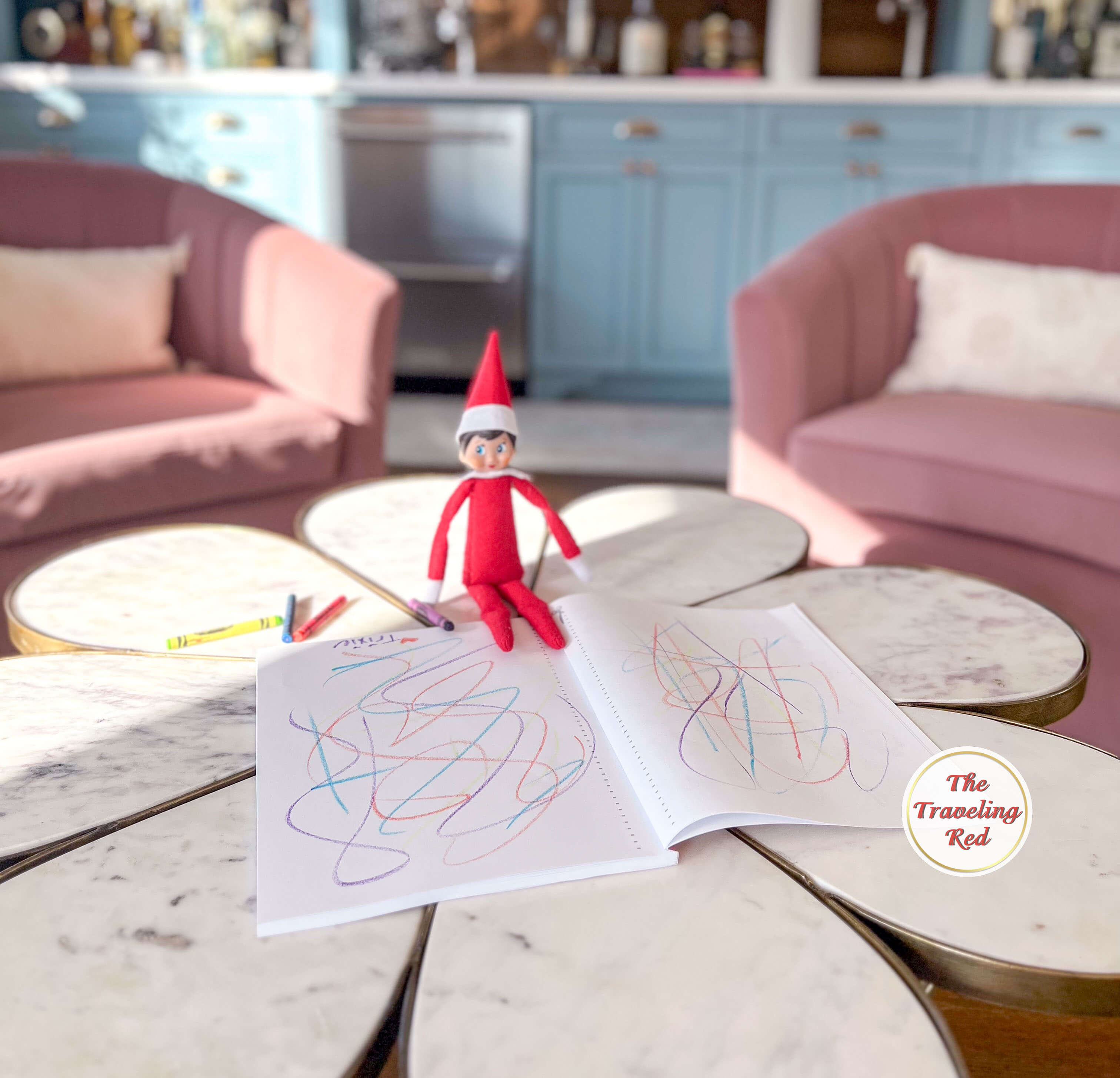 Elf on the Shelf Ideas: Elf colored a new sketchpad making a messy drawing by the elf. Over 100 easy and quick elf on the shelf ideas that are fun. By The Traveling Red
