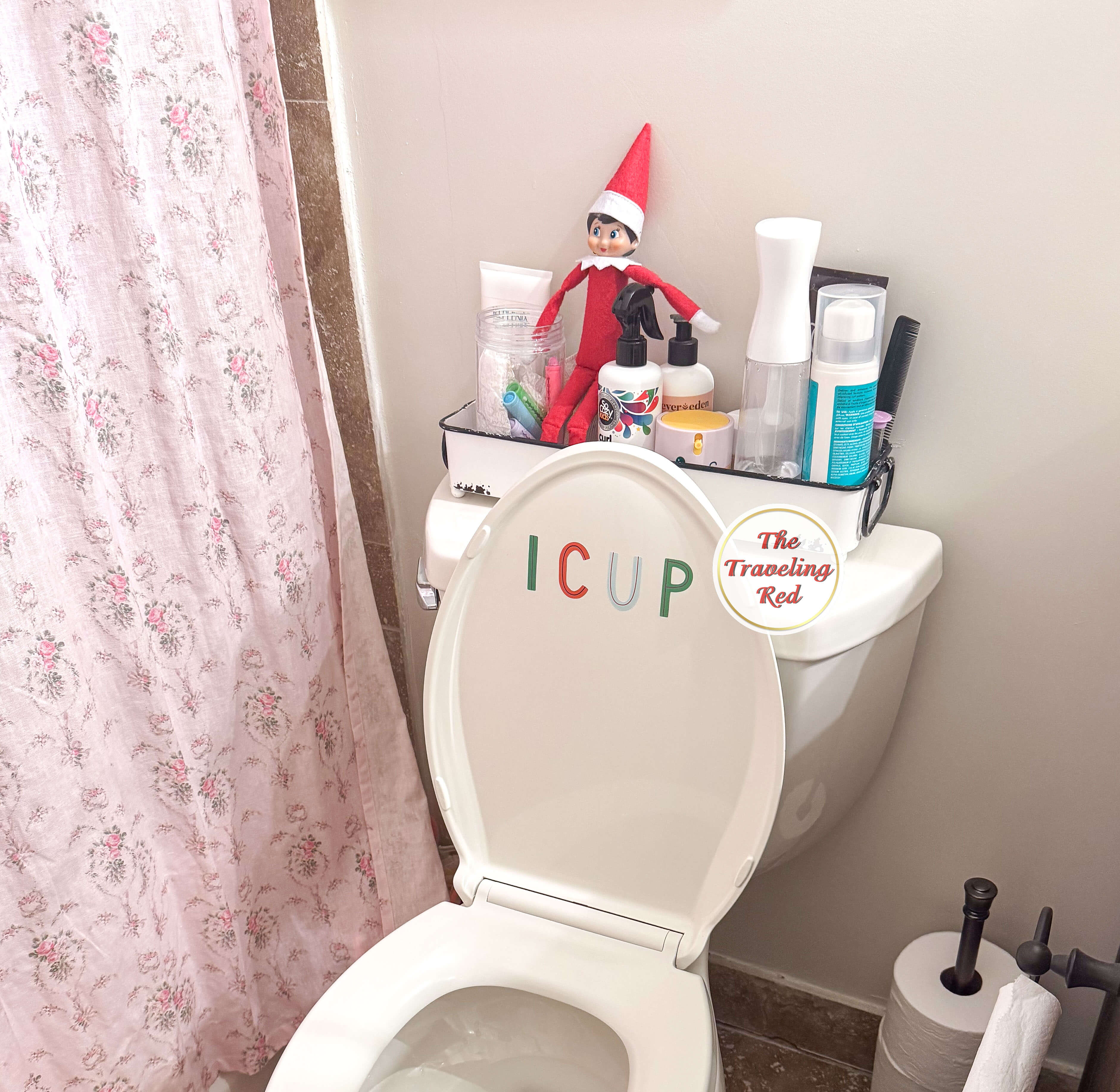 Elf on the Shelf Ideas: Elf is on top of the toilet and on the lid there's sticker letters of I C U P which comes from the common children's joke asking you to spell I Cup. Over 100 easy and quick elf on the shelf ideas that are fun. By The Traveling Red