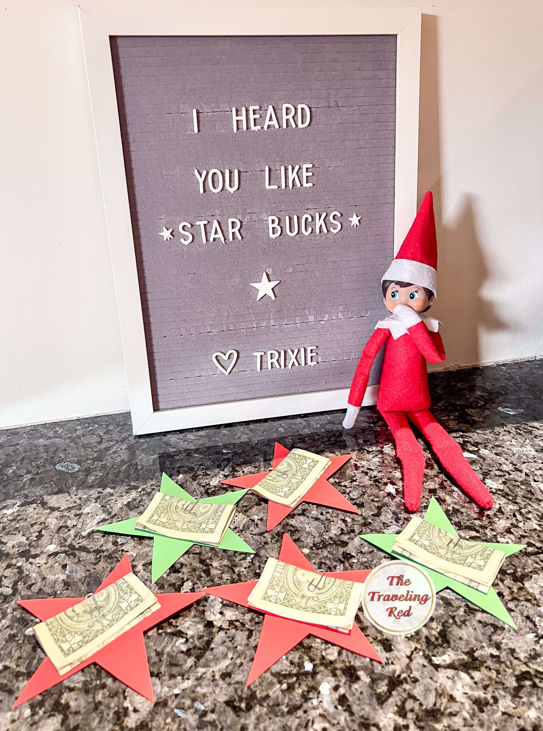 Elf on the Shelf Ideas: Elf cut out stars from paper and paper clipped $1 to each star. The message board reads "I heard you like star bucks" which is a play on starbucks. Over 100 easy and quick elf on the shelf ideas that are fun. By The Traveling Red