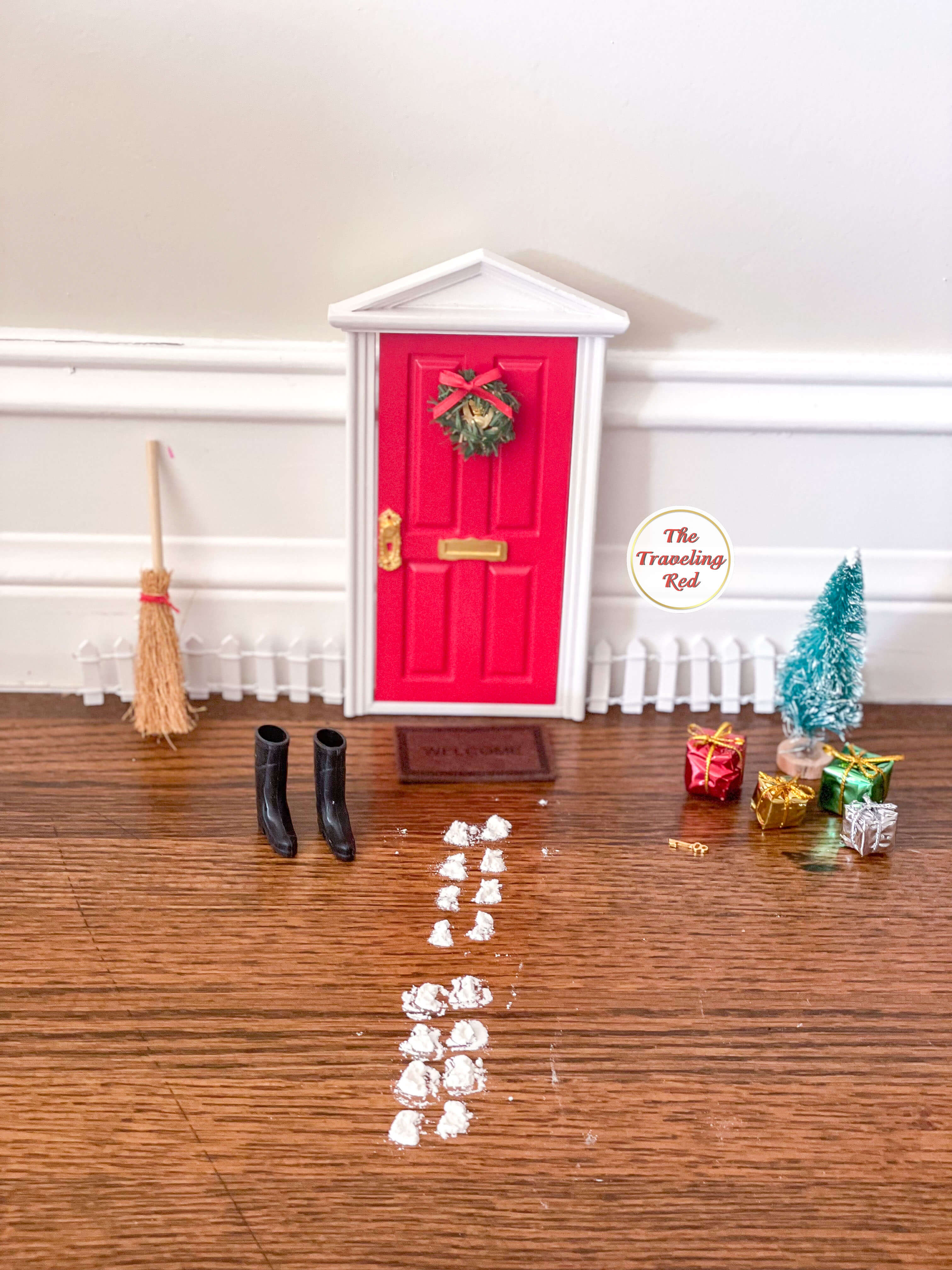 Elf on the Shelf Ideas: Elf door for arrival and departure day. It's a miniature fairy door with accessories for your elf. Over 100 easy and quick elf on the shelf ideas that are fun. By The Traveling Red