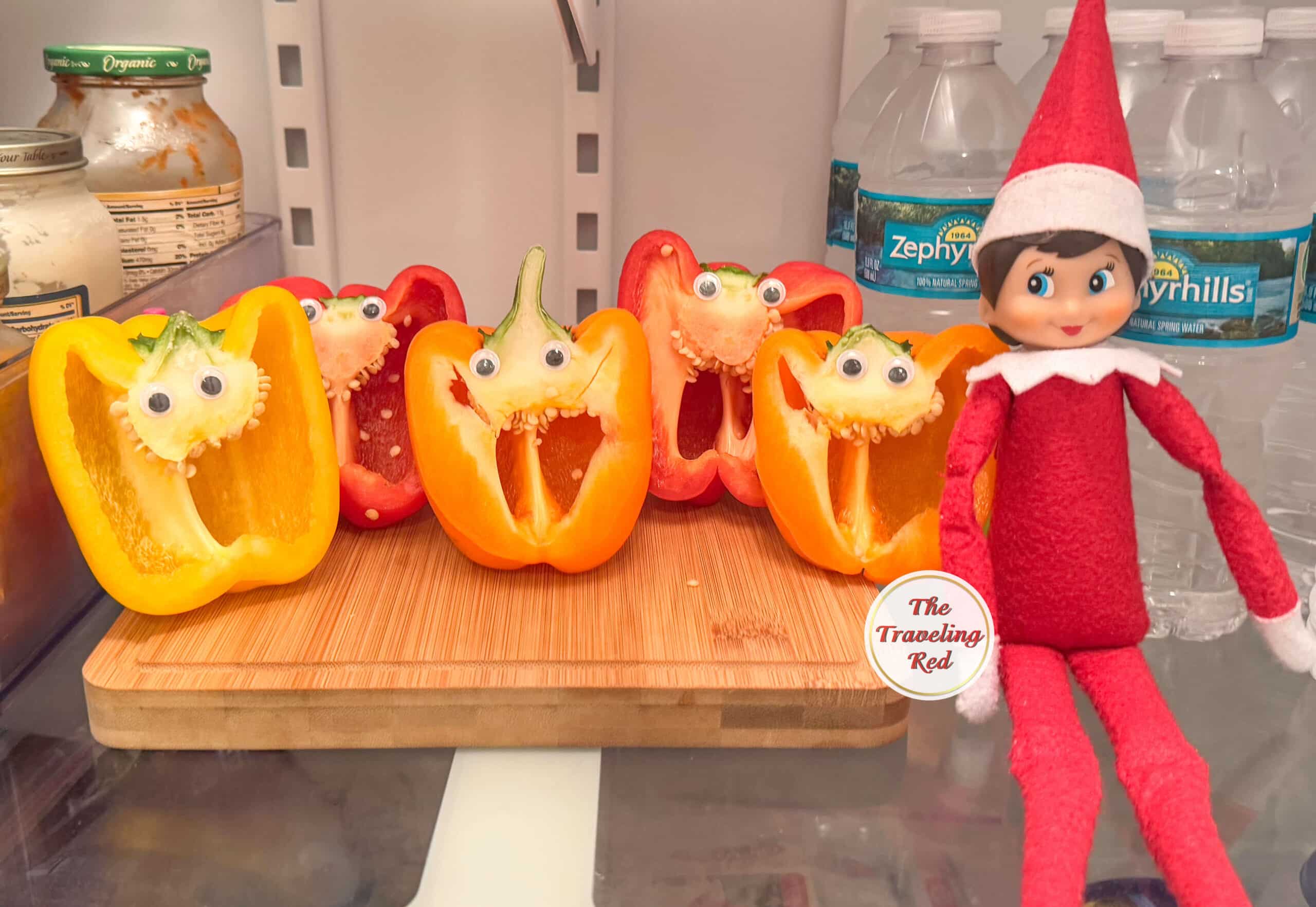 Elf on the Shelf Ideas: Elf is in the fridge next to bell peppers that were cup in half and have googly eyes on them so they look like happy faces. Over 100 easy and quick elf on the shelf ideas that are fun. By The Traveling Red