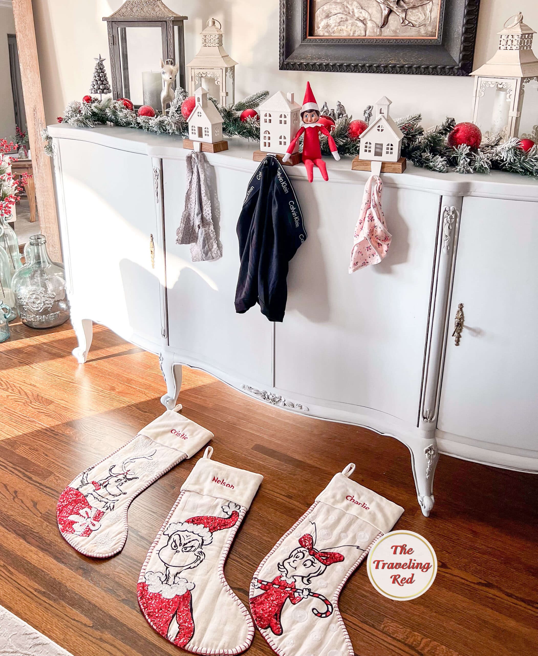 Elf on the Shelf Ideas: Elf changed the stockings for our underwear. Each persons stocking is on the floor with their underwear hanging instead. Over 100 easy and quick elf on the shelf ideas that are fun. By The Traveling RedElf on the Shelf Ideas: Elf made a tower out of books and is on the top reading a book. Over 100 easy and quick elf on the shelf ideas that are fun. By The Traveling Red