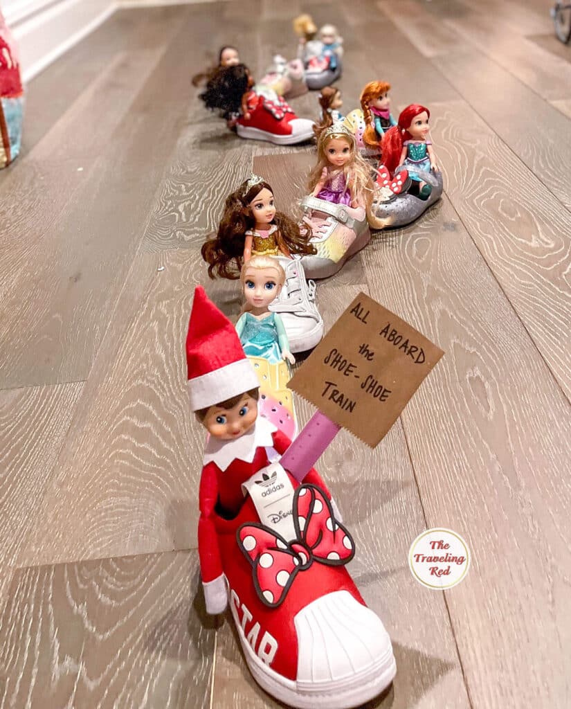 Elf on the Shelf Ideas: Elf made a Shoe Shoe Train which is a play on Choo Choo train. Its several shoes lined up, each with a doll or toy inside and a sign on the front. Over 100 easy and quick elf on the shelf ideas that are fun. By The Traveling Red