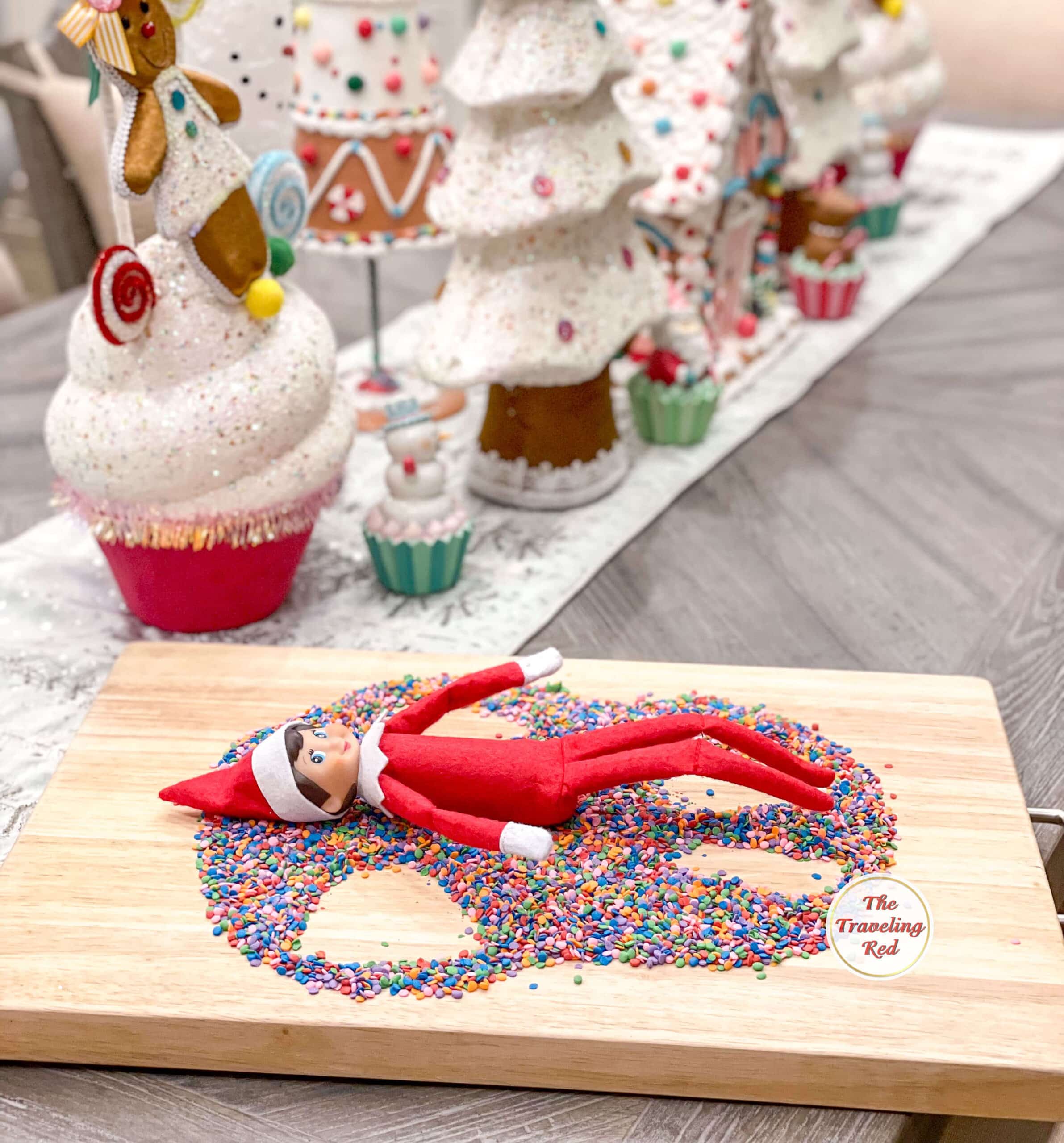 Elf on the Shelf Ideas: Elf made a sprinkle angel just just a snow angel but on a cutting board covered in sprinkles. Over 100 easy and quick elf on the shelf ideas that are fun. By The Traveling Red