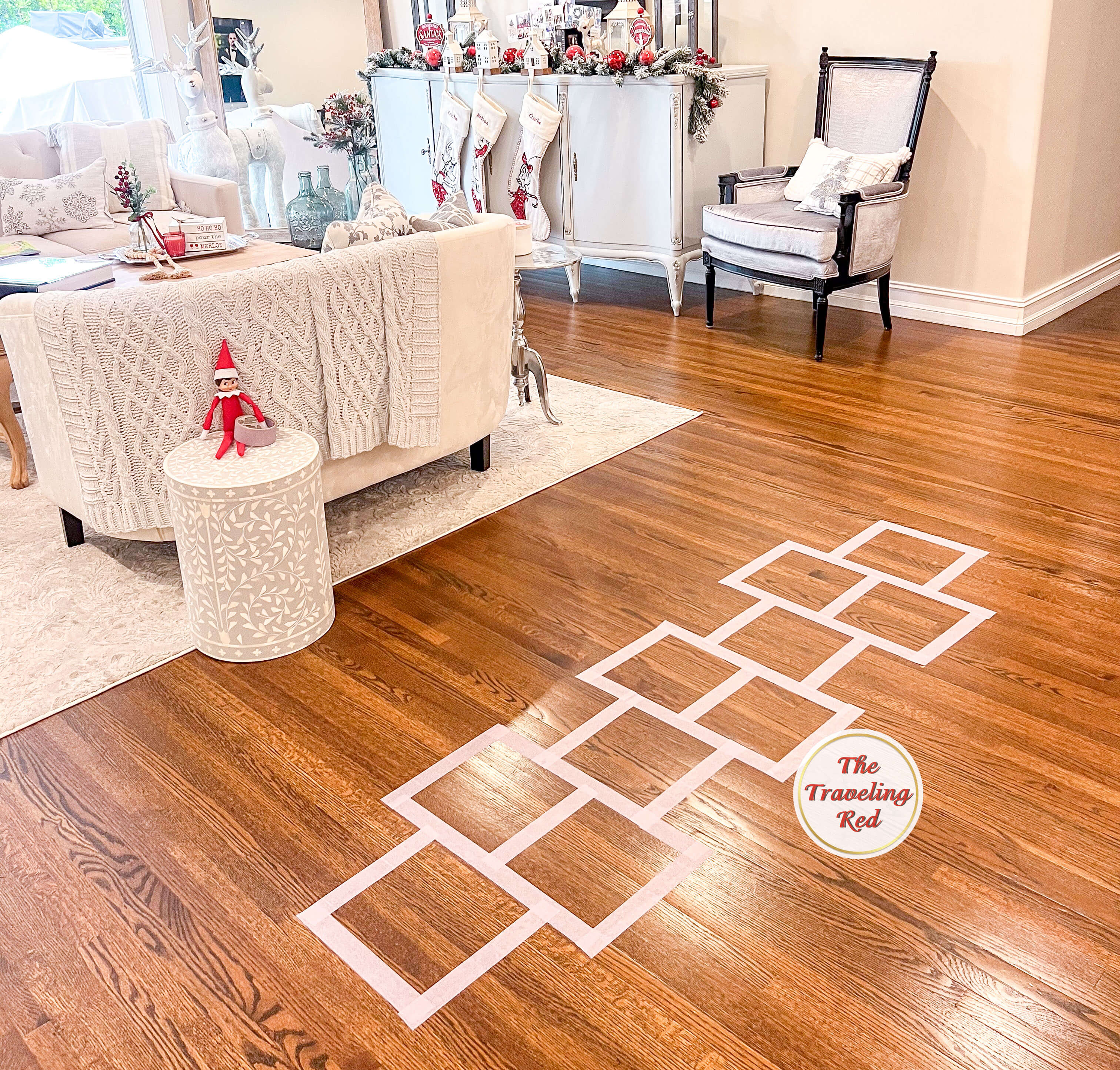 Elf on the Shelf Ideas: Elf used painters tape to make a hopscotch board on the floor. Over 100 easy and quick elf on the shelf ideas that are fun. By The Traveling Red